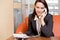 Businesswoman conversing on landline phone, portrait