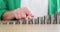 Businesswoman counting stacks of coins and growth of financial income