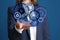 Businesswoman demonstrating gear mechanism on background, closeup