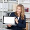 Businesswoman Displaying Laptop With Blank Screen