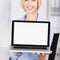 Businesswoman Displaying Laptop In Office