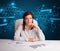 Businesswoman doing paperwork with futuristic background