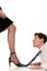 Businesswoman dominating businessman