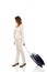 Businesswoman dragging suitcase.