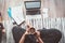 Businesswoman dressed in pajamas enjoying morning coffee on the floor office with laptop, papers top view shot. Distance