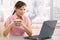 Businesswoman drinking coffee at desk