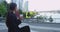 Businesswoman drinking coffee outside in downtown Vancouver Canada