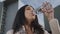 Businesswoman drinking water from bottle on street. Girl enjoying fresh water