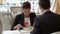 Businesswoman eating with a businessman