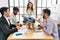 Businesswoman enjoys meditating during meeting