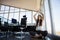 Businesswoman with eyes closed doing yoga on floor