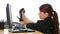 Businesswoman with feet up on desk