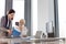 Businesswoman and female manager reading book at desk in office