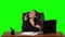 Businesswoman flirting on the phone from the workplace. Green screen. Slow motion