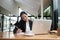 Businesswoman in formal suit calling and taking note on notebook.