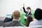 Businesswoman Giving Presentation To Colleagues In Seminar Hall