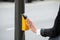 Businesswoman Hand Pressing Yellow Crosswalk Button