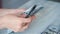 Businesswoman hands count dollar bills on table