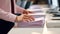 Businesswoman hands working in Stacks of paper files for searching and checking unfinished documents achieves on folders papers at