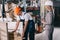 Businesswoman in helmet looking at loader