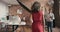 A businesswoman helping a group of diverse team members in her office. Happy businesswoman walking through her office