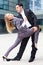 Businesswoman with her collegue are dancing tango