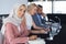 Businesswoman in hijab looking at camera at table in conference