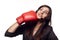 Businesswoman hitting herself with boxing gloves