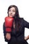 Businesswoman hitting herself with boxing gloves