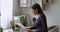 Businesswoman hold documents paper use laptop working seated at desk