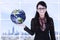 Businesswoman hold earth - indoor