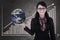 Businesswoman hold globe on growing bar chart chalkboard