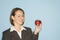 Businesswoman holding apple.