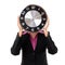 Businesswoman holding clock over face