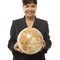 Businesswoman holding globe.