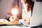 Businesswoman Holding Illuminated Light Bulb