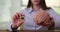 Businesswoman holds tiny computer chip in plastic model of human brain