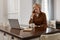 Businesswoman Homework. Female With Laptop. Mature Woman In Brown Jacket And Eyeglasses Talks On Phone.