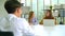 Businesswoman and HR manager sitting in meeting room and interviewing businessman, HR Manager have positive first impression of a