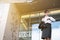 Businesswoman in a hurry holding coffee and looking at her watch