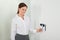 Businesswoman Inserting Keycard In Security System