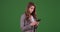 Businesswoman intern using smartphone to communicate team members green screen