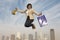 Businesswoman Jumping With Shopping Bags