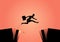 Businesswoman jumps over the ravine