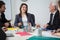 Businesswoman laughing during business meeting