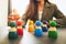 Businesswoman leader choosing wooden people figure from a group of employees