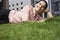 Businesswoman Listening Music While Lying On Grass