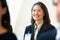 Businesswoman Listening To Speaker At Conference