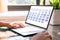 Businesswoman Looking At Calendar On Laptop