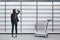 Businesswoman looking on empty shop white shelves